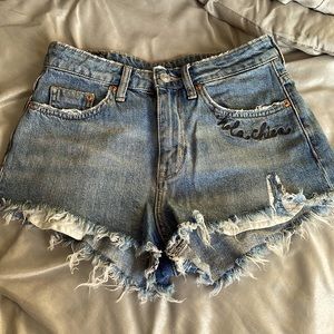 High waisted ripped jean shorts with graphics. H&M Sz 6